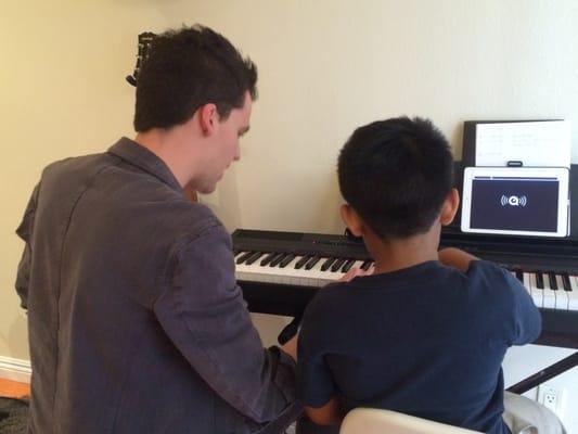 Marius teaching Aiden Piano. Aiden is 7 years old.