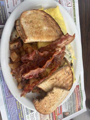 Omelette with spinach, Swiss cheese, mushrooms, rye, toast, bacon, and home fries.  Best !!!