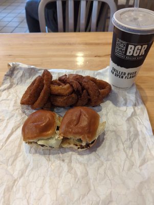 Sliders, onion rings and drink.