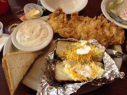 Chicken fried chicken with baked potato and cream gravy...Yumm