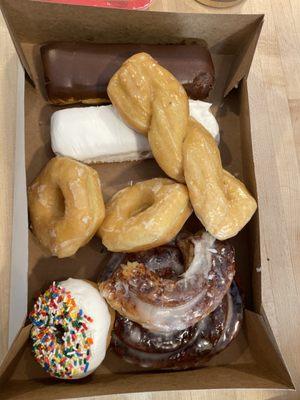 Donuts we bought today. Large cinnamon roll donut in bottom of picture