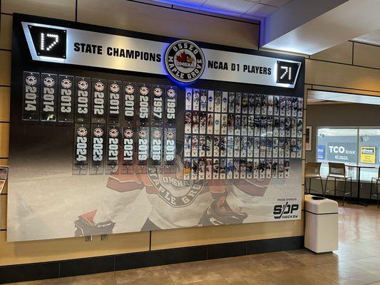 Some college hockey players who once skated here are in this display.