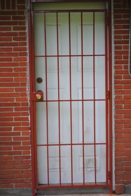 What goes good with orange brick? Why, an orange security door of course.  Lifetime warranty on all welding.