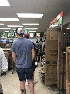 Hour long line. One person working.