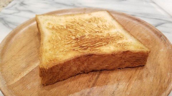 Croissant loaf slice toasted. I have finally found you! Can you tell those are flakey layers inside the loaf? This is my favorite! 9/18/2020