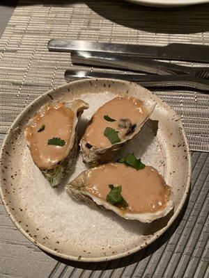 Broiled oysters with leek and blood orange glacage