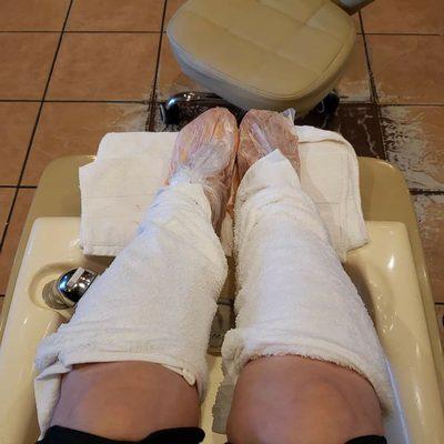 Deluxe Pedicure.  Love these hot towels, rocks and wax bags.  Feels amazing!!!