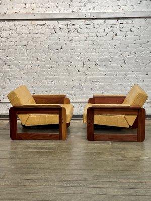 Pair of lafers in custom upholstery.