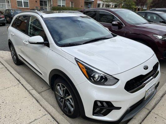 Compact car exterior wash and wax super shinny.