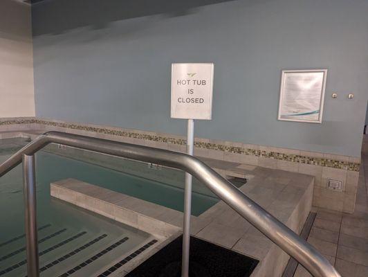 Hot tub closed 30 mins before pool close time which is 15 mins before posted gym time.