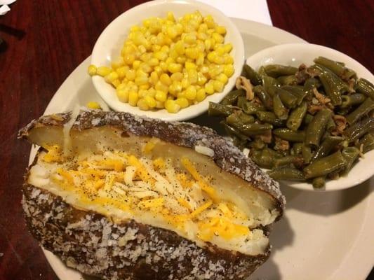 Baked potato, green beans, and corn