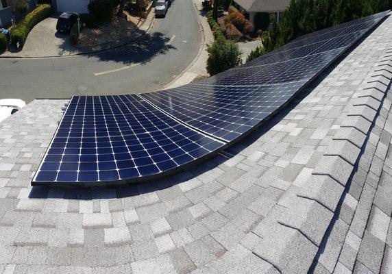 Panorama view of the 24, out of 26 panels. A 9.1kW system using 24 panels in the southern roof, plus two on a reverse-tilt bracket.