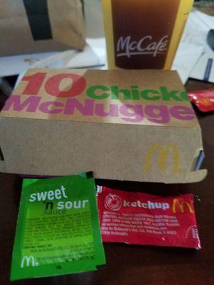 10 piece chicken nuggets with sweet 'n sour sauce and a packet of ketchup.