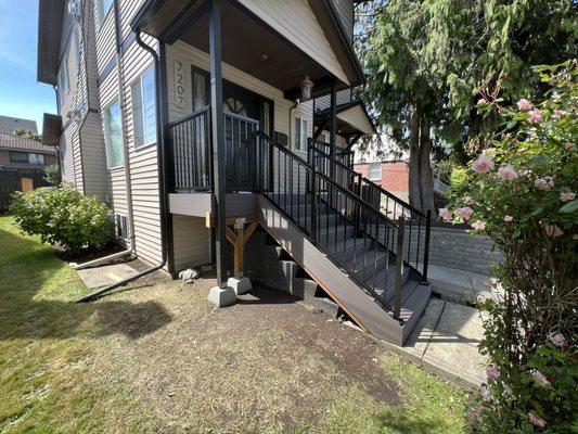 Riggins Construction LLC Timbertech Azek Dark Hickory composite decking porch & stairs & our black metal railings