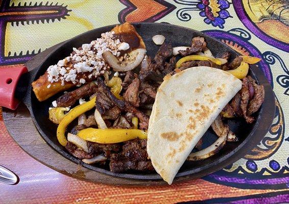 Carne Asada comes with rice, beans, quesadilia, and a cheese enchilada