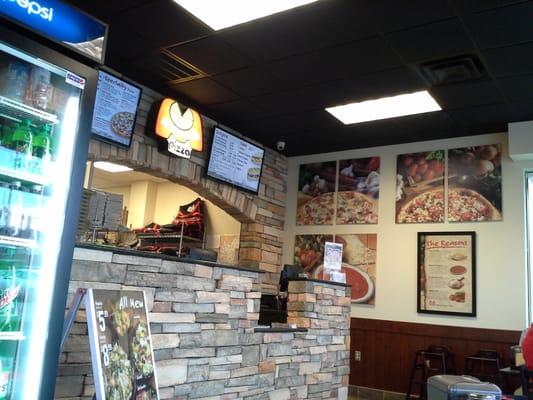 the counter with the drink cooler on the left