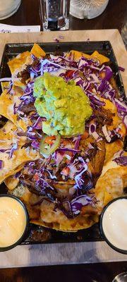 Nachos with Pulled Pork lime crema on the side