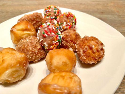 One Dozen Assorted Donut Holes. Received four of each: glazed, apple cinnamon crumb, and glazed with sprinkles.