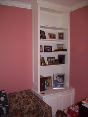 one of two matching cupboards on either side of couch in a media room