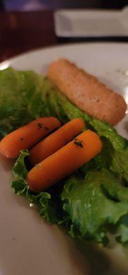 Baby carrots which seem to appear on a lettuce leaf three at a time but all turned over from cut.