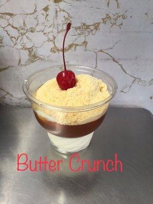 Butter crunch sundae: hot caramel/butterscotch and powdered candy topping. Taste like the inside of a Butterfinger. Very sticky and sweet.