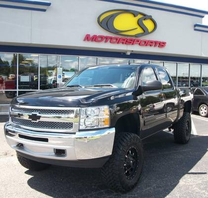 2013 Chevy Silverado (730) * 7.5" Rough Country Lift Kit  * 18x9 Fuel KRANK Wheels * 35x12.50x18 Nitto TRAIL GRAPPLER Tires * AMP Power Stps