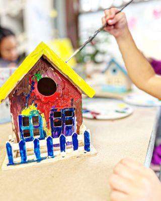 Four year old painting, a birdhouse