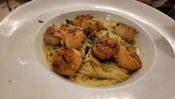 Scallops over Linguine.  Most restaurants only serve 3 or 4.