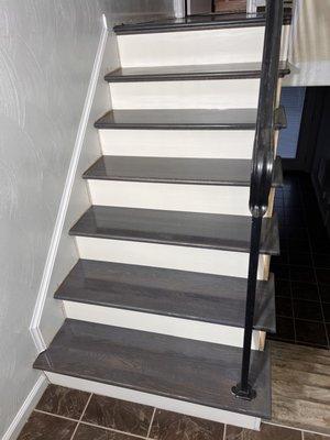 Installation of new treads and risers stained with dark gray using white oak with Loba finish