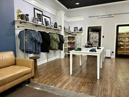 Inside Stories front retail store front.  Cigars, Accessories, Gifts, & Apparel.  With seating area.