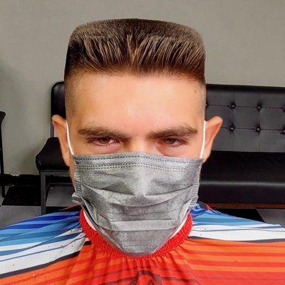 Man getting flattop haircut at barber shop