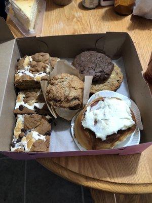 S'mores bars, cinnamon roll with frosting, beach bum cookies, double chocolate chip cookie and a banana walnut muffin.