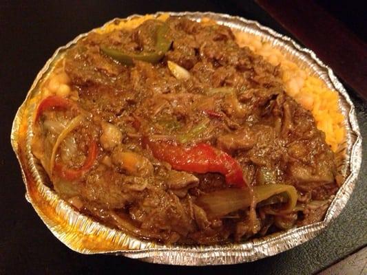 Beef stew on top of beans and rice. $7