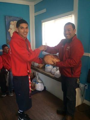 Mr. Flores handing out hams and turkeys for thanksgiving to our workers! We appreciate all your hard work!