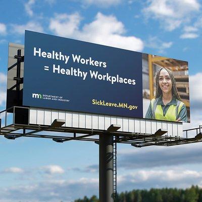 Billboard informing citizens of the new sick and safe time laws for Minnesota Department of Labor