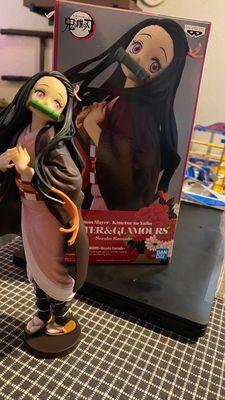 Gorgeous Nezuko figure among so many others I have from the shop!