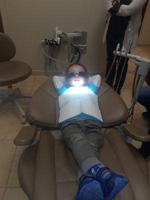 A 3yr old relaxed getting his teeth checked.