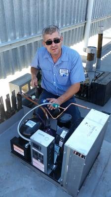 Replacing condenser unit for walk in cooler.