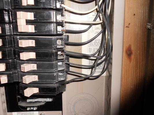 Double tap in main panel  observed during home inspection. (2 wires in one Breaker)