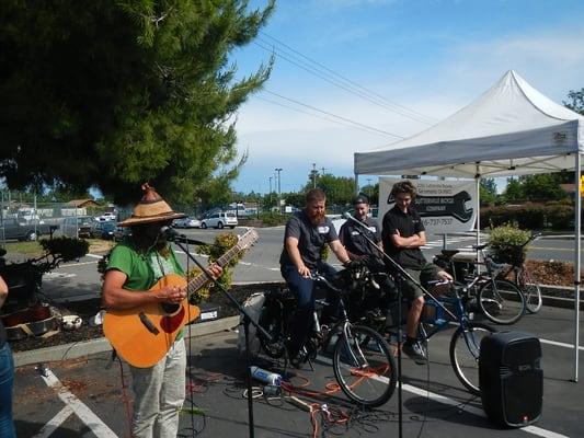 Sutterville crew powering the 'Sacramento Rolling Bicycle Music Festival' bikes in their parking lot .