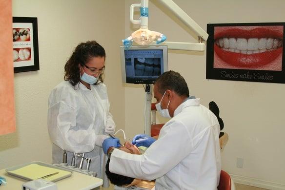 Dr. Portilla With A Dental Patient