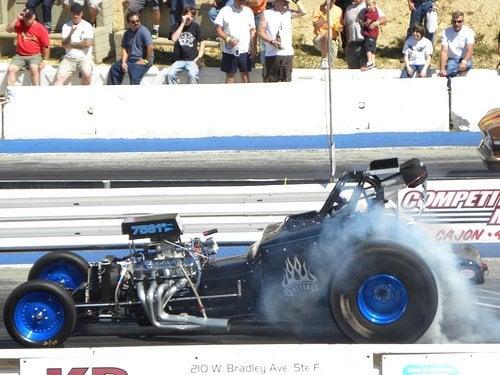 Hot rod smoking the tires on the drag strip