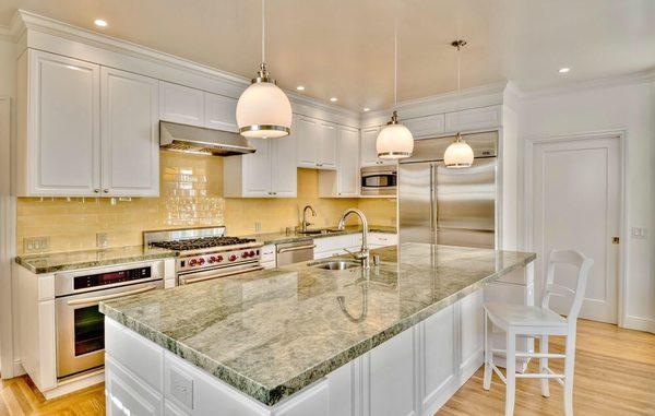 Bespoke "Crema" kitchen finished in white satin conversion varnish.