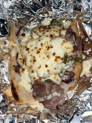 Italian beef with sweet peppers and mozzarella cheese. Light dip. Delicious . It's big enough for two people