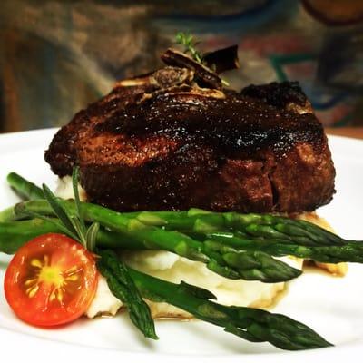 AB 12 ounce bone in Ribeye steak on top parma cream potatoes, blanched asparagus finished wit fried shallots & herbed butter :)'