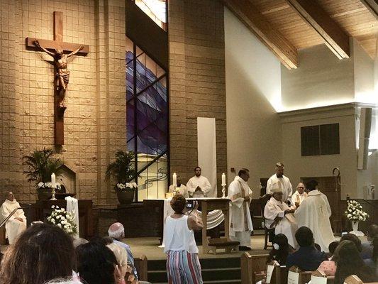 Bishop Calvo ordaining 2 new priests.