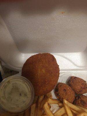 Small crab cake and overdone hush puppies