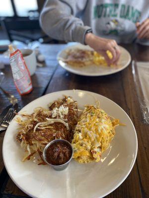 Chorizo omelette with hash browns on the side.