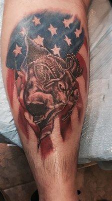 Ram flag tattoo on calf