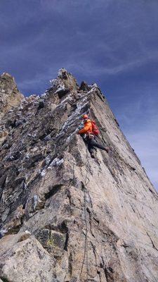 A climber on Sharkfin Tower in Boston Basin, Washington State.